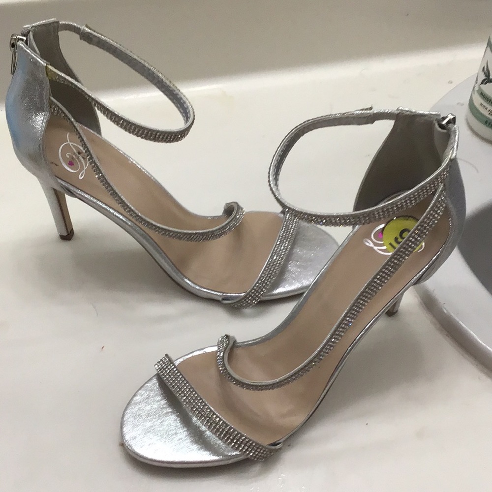 Silver high heel shoes.